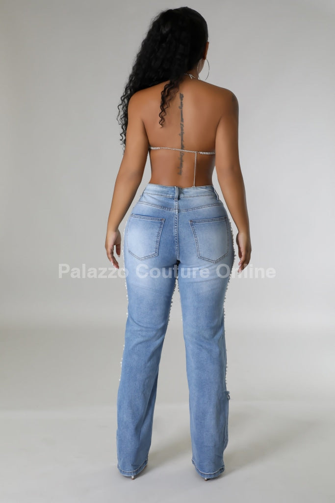 Women's Pearl Jeans showcasing pearl details.