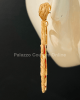 Brown statement earrings with tropical leaf design