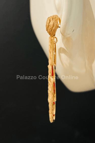 Brown statement earrings with tropical leaf design