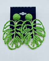 Bold green earrings in leaf shape