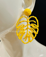 Yellow statement earrings with tropical leaf design