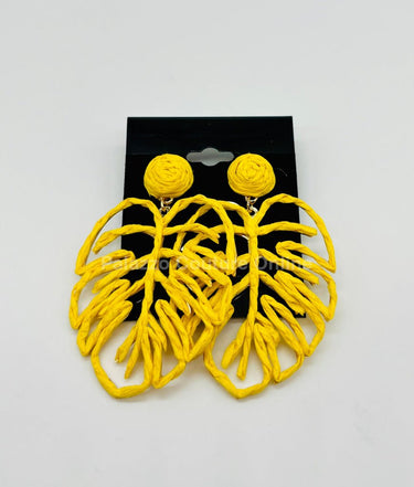 Yellow statement earrings with tropical leaf design