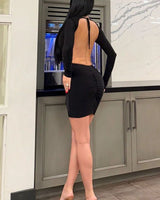 Eclipse Allure Open-Back Mini Dress - Black side view highlighting short hemline