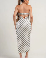 Elegant knit midi dress with clear sequin detailing and asymmetrical hemline