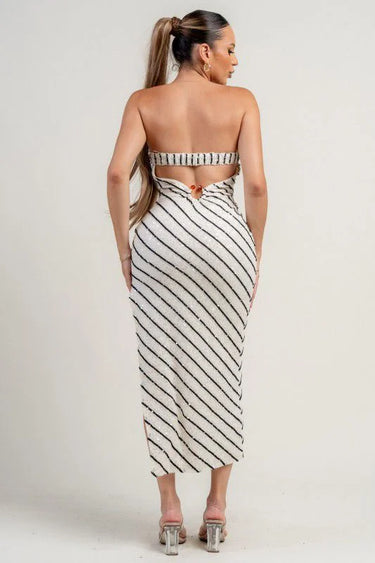 Elegant knit midi dress with clear sequin detailing and asymmetrical hemline