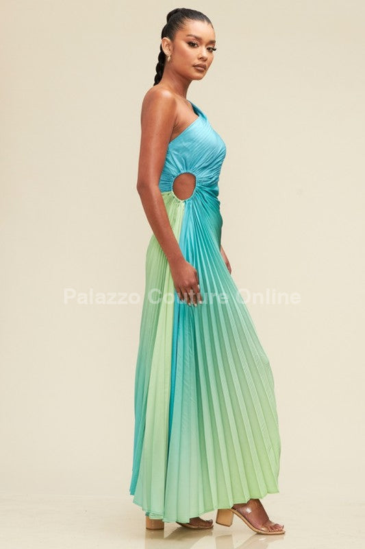 A stunning one-shoulder dress featuring an ombre effect transitioning from blue to green, designed with elegant pleats for a flowing and sophisticated look.
