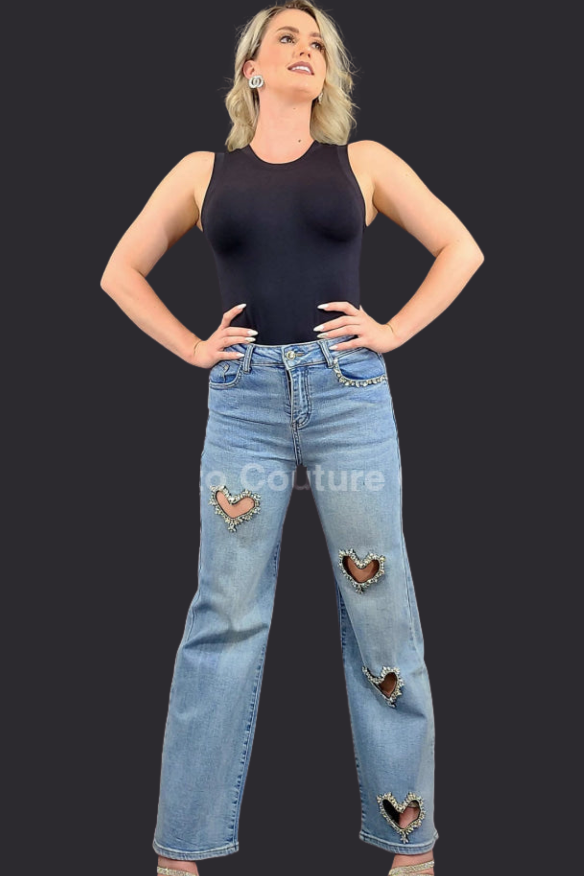 Enchanted Hearts Embellished Denim Jeans with heart-shaped rhinestone cutouts and a black sleeveless top