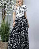 Face Graphic Print Palazzo Pants (Black) - front view