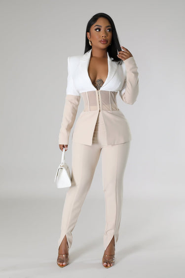 Close‐up of two piece pant set showing blazer detail and high‑waisted pants