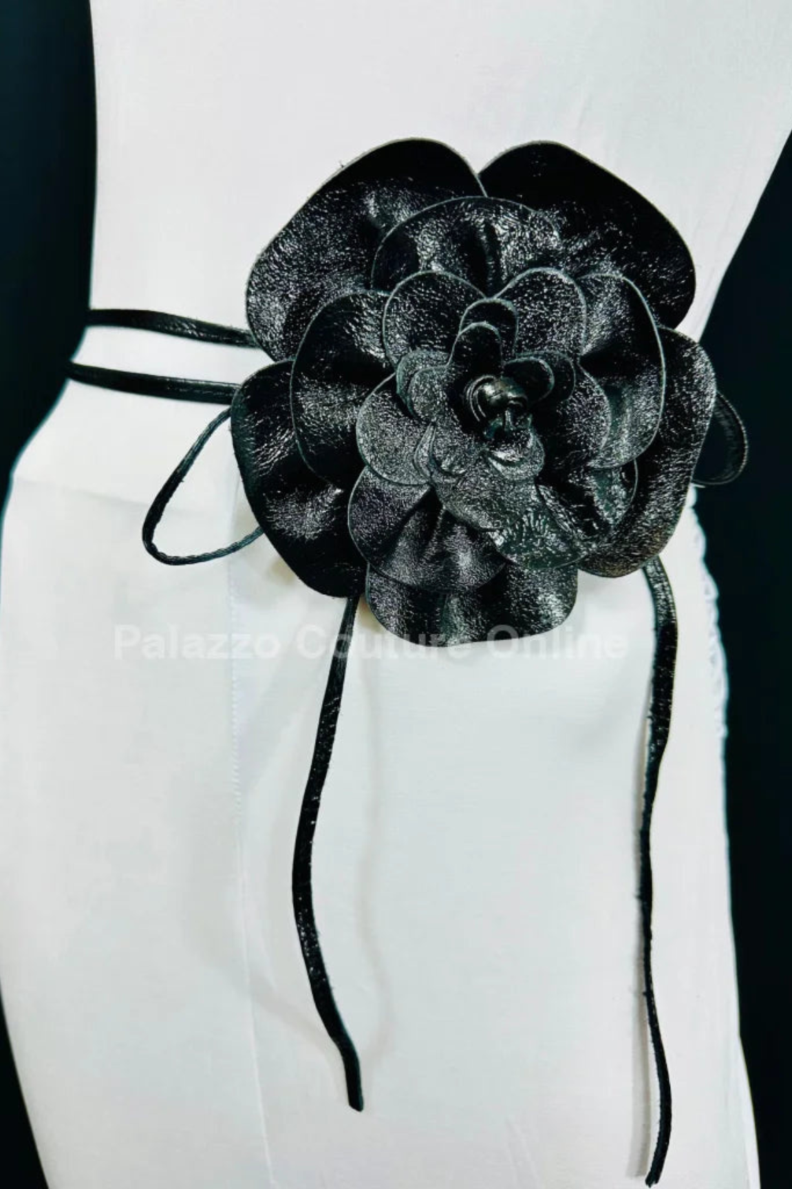 Convertible black leather choker with a stunning flower centerpiece.