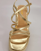 Gold wedge sandals with ankle strap and platform heel