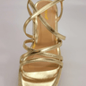Gold wedge sandals with ankle strap and platform heel