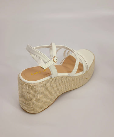 Side view of White wedge sandals with 3.5-inch heel