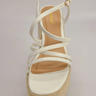 White wedge sandals with ankle strap and platform heel