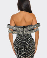 Back zipper detail of the Glam Luxe black mini dress