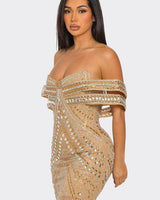 Back view of nude mini dress with zipper closure and fitted silhouette