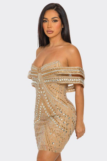 Back view of nude mini dress with zipper closure and fitted silhouette