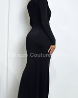 Black fitted maxi dress with dramatic plunge neckline