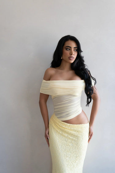 Elegant Butter off-shoulder maxi dress on model styled for evening event