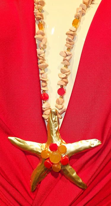 Golden starfish pendant necklace in pink gold with gemstone drop detail for women