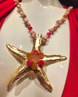Layered gemstone drop necklace with gold starfish charm – pink gold summer accessory