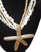 Beach style layered necklace in white gold featuring starfish pendant – resort‑wear jewelry
