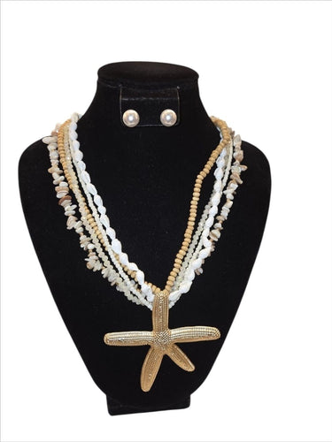 White gold layered ocean charm necklace with starfish and shell design – statement piece