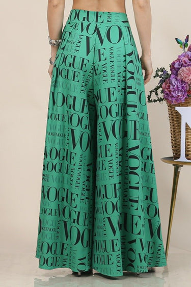 Printed palazzo pants in green with wide waistband and flowing legs