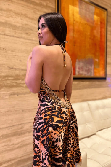 Elegant  halter mini dress on model styled for going out