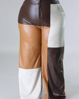 Close‑up of wide leg faux leather cargo pants showing faux leather texture and pocket detail