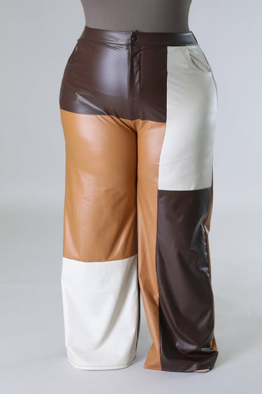 Close‑up of wide leg faux leather cargo pants showing faux leather texture and pocket detail