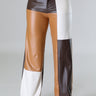 Close‑up of wide leg faux leather cargo pants showing faux leather texture and pocket detail