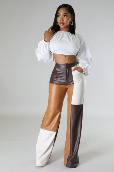 Back view of wide leg faux leather cargo pants – cargo pockets and straight leg silhouette
