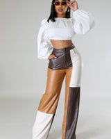 Wide leg faux leather cargo pants laid flat – high waist and utility style