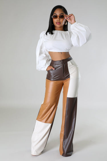 Wide leg faux leather cargo pants laid flat – high waist and utility style