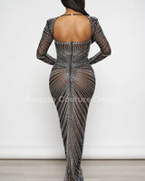 Her Special Black Evening Gown with Rhinestone Embellishment side view highlighting floor-length hemline