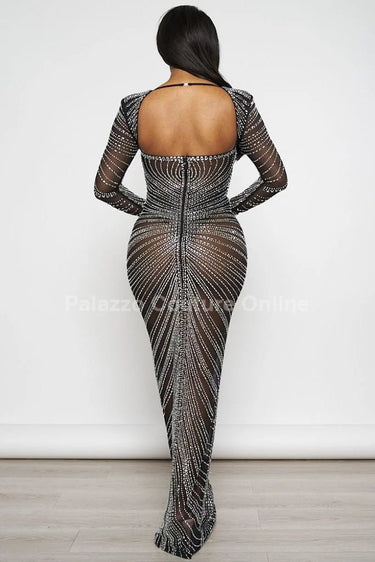 Her Special Black Evening Gown with Rhinestone Embellishment side view highlighting floor-length hemline