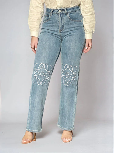 High-Rise Straight Leg Jeans with Embroidered Knee Detail close up of straight fabric and construction detail