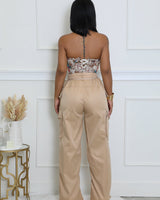 Beige wide leg pants laid flat – clean beige trousers with wide leg style