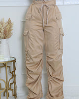 Close‑up of beige wide leg pants fabric texture and waistband detail