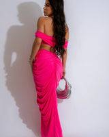 Close-up of ruched fabric on fuchsia skirt and top