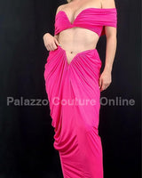 Close-up of ruched fabric on fuchsia skirt and top