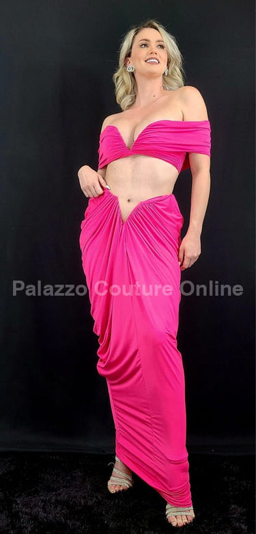 Close-up of ruched fabric on fuchsia skirt and top