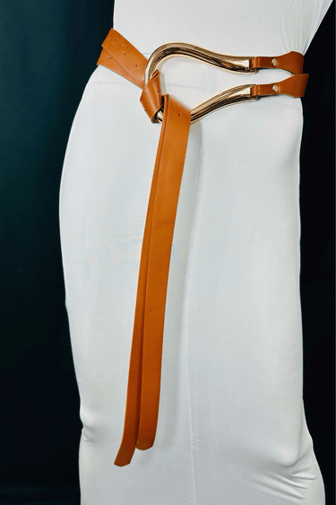 Brown waist belt with curved gold metal accent and adjustable fit