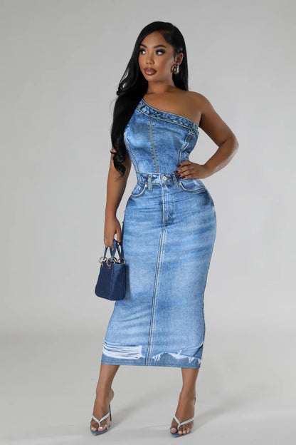 one-shoulder denim dress with a distressed hem, accessorized with blue heels and a matching handbag