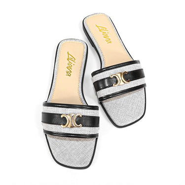 Black flat sandals with gold insole detail – summer footwear by Joey