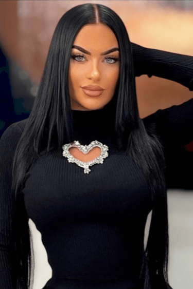 Black turtleneck top with heart-shaped chest cutout design