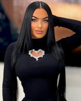 Long sleeve black knit top with stretch and heart detail