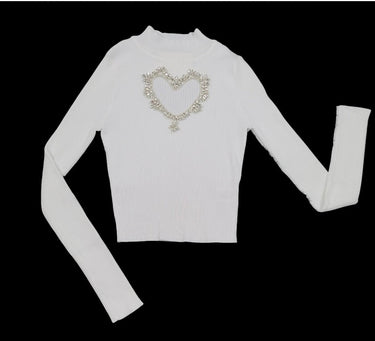 white heart cutout turtleneck top made of soft acrylic and nylon fabric