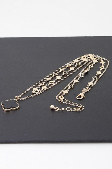 Clover necklace with gold chain and black charm pendant